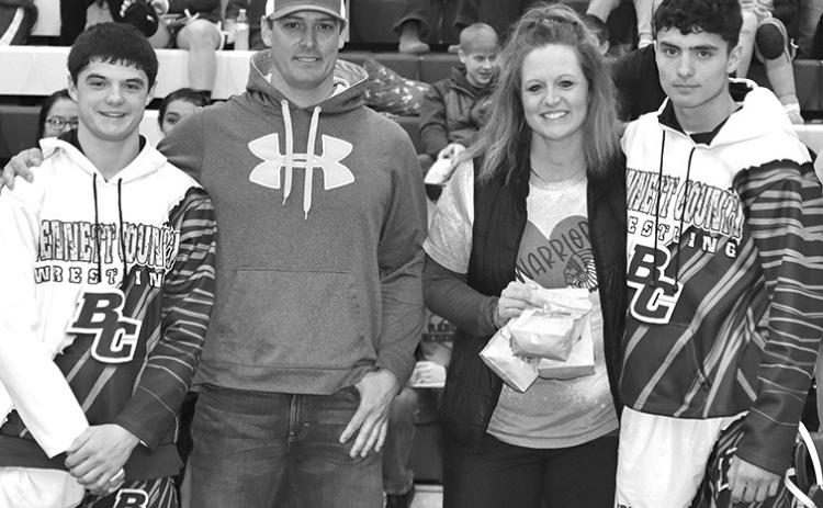 Photo by Mandy Scherer Bennett County Wrestling Parent’s were honored Saturday, February 10. Tel and Tyce Gropper honor their parent’s Gabe and Jami.