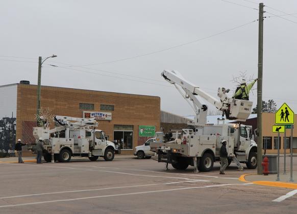 Photo by Taylor Risse  The snowflakes were hung on the light poles with care, in hopes that Christmas would soon be there! Christmas is fast approaching and the Lacreek Electric crew helped Martin get ready for the Christmas season as they hung the snowflakes on Wednesday.