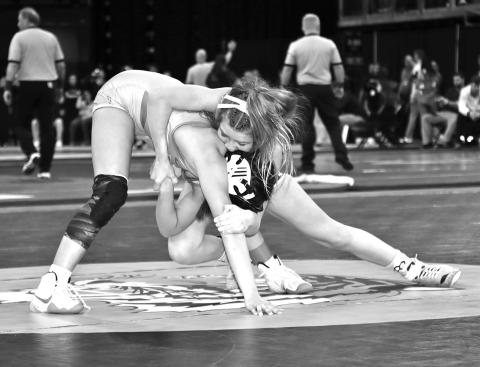 Photo by Mandy Scherer Kendyll Risse attempts to breakdown Mataya Jacobs in the 100 pounds girls match at the South Dakota High School State Wrestling Championships.