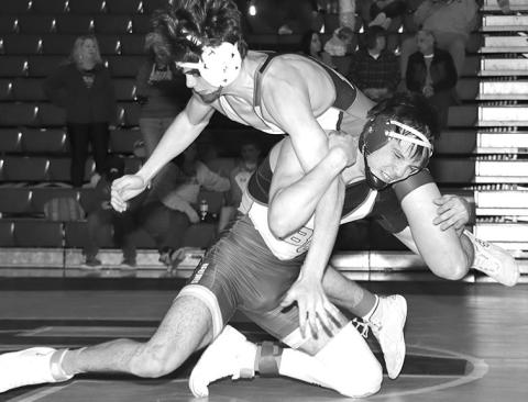 Photo by Mandy Scherer Talon Krolikowski shoots in during his 157 pound finals match at the Bennett County Wrestling Tournament held Saturday, February 10.