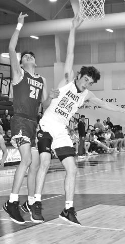 Photo by Mandy Scherer Camden O’Bryan goes up to block a Tiger layup.