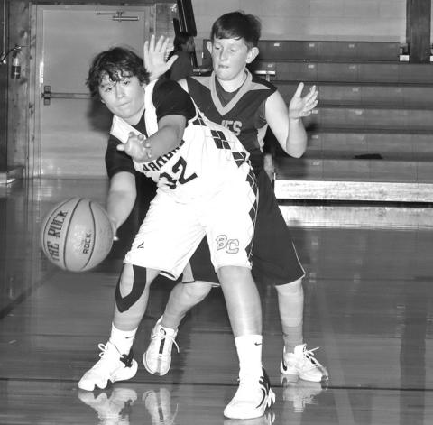 Photo by Mandy Scherer Sean Noel passes the ball out to an open teammate against Philip.