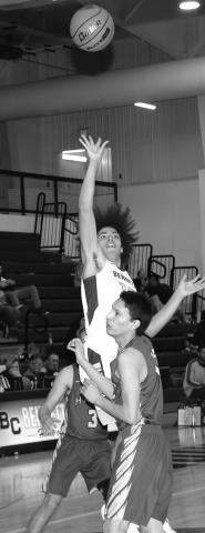 Photo by Taylor Risse Ben Theurer shoots a short jumper over a Hay Springs Hawk.