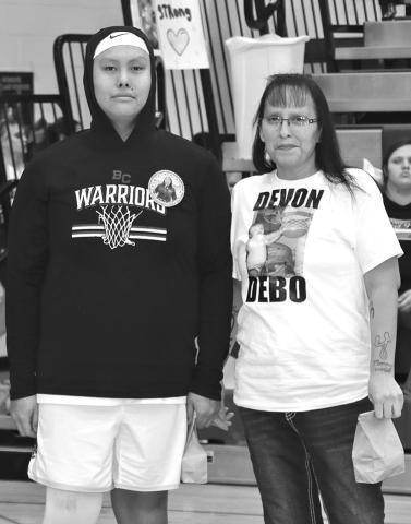 Photo by Mandy Scherer Senior basketball player Devon Featherman recognizes his family during Parent’s Night.