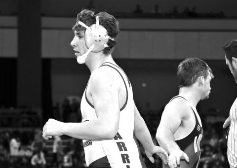 Photo by Mandy Scherer Ethan Harris shakes hands with his opponent after his first round state finals match at 190 pounds.