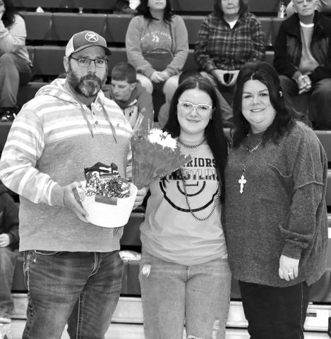 Photo by Mandy Scherer Wrestling manager Lily Cotten with her parent’s on Saturday.