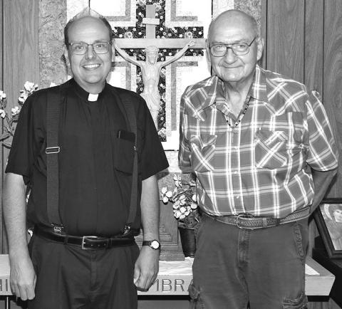 Photo by Tim Huether Fr. Tyler Dennis, left, is pictured with Deacon Cal Clifford last Wednesday during a going away gathering for him at the Our Lady of the Sacred Heart Catholic Church in Martin. Fr. Tyler also celebrated his 15 year of being ordained a Catholic priest on Wednesday.