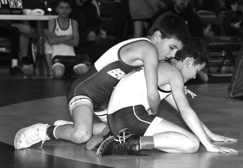 Photo by Taylor Risse Laeton Livermont works hard towards his second place medal.