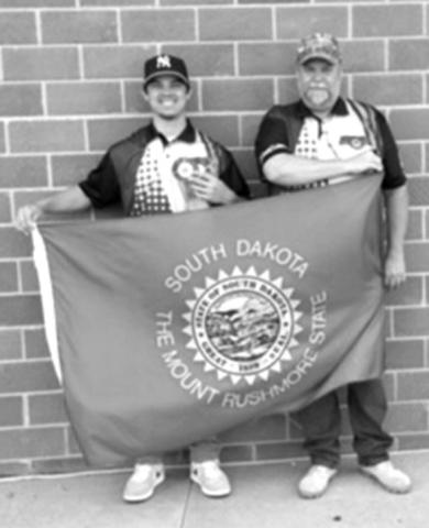 Photo submitted Danté Rascher pictured with coach Brian Fatherlos at the National Shooting Sports championship.