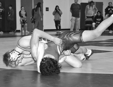 Photo by Mandy Scherer Jordan Risse works to get back points during the Bennett County Wrestling Tournament held Saturday, February 10.