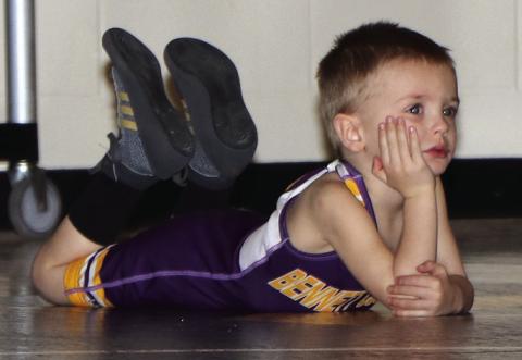 Photo by Taylor Risse Jaxx Risse takes in the Bennett County AAU meet on Sunday. It gets to be a long day for a tough Little Warrior!