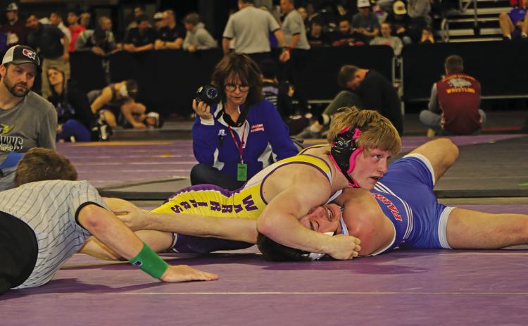 Photo by Mandy Scherer Gavin Risse won his first round at 138 pounds against Kaden Holzbauer. See full story on page 5.