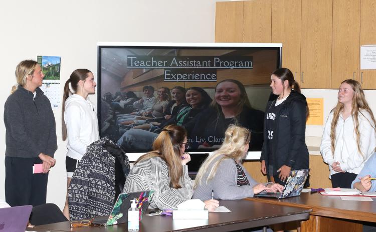 Photo by Tim Huether  Bennett County High School students from left: Liv McMillan, Madi Waln, Raven Heathershaw and Clara Weber did a nice job on their presentation to the Bennett County School District Board Monday night. They are involved in the Teacher Assistant Program and informed the board of how it works and what they have experienced through it.