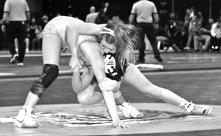 Photo by Mandy Scherer Kendyll Risse attempts to breakdown Mataya Jacobs in the 100 pounds girls match at the South Dakota High School State Wrestling Championships.