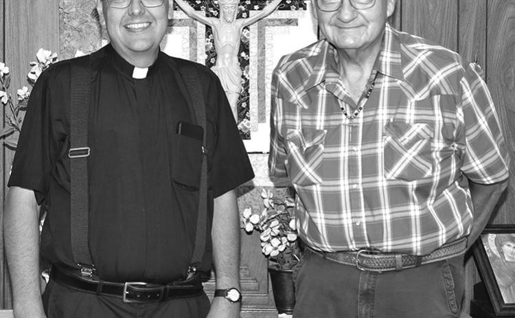 Photo by Tim Huether Fr. Tyler Dennis, left, is pictured with Deacon Cal Clifford last Wednesday during a going away gathering for him at the Our Lady of the Sacred Heart Catholic Church in Martin. Fr. Tyler also celebrated his 15 year of being ordained a Catholic priest on Wednesday.
