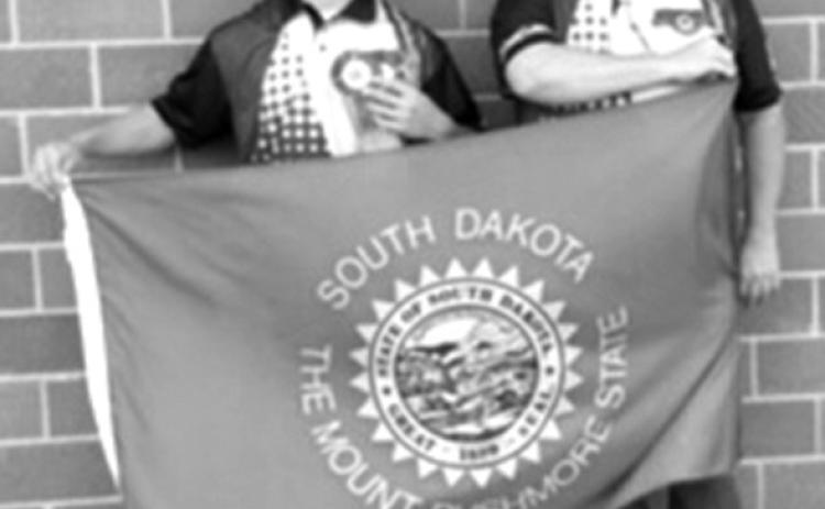 Photo submitted Danté Rascher pictured with coach Brian Fatherlos at the National Shooting Sports championship.